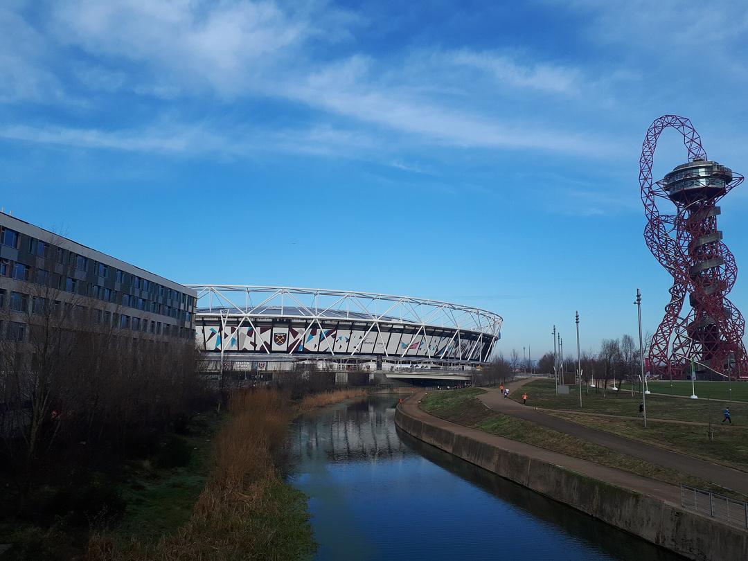 London Stadium across the river in Queen Elizabeth Olympic Park, with the ArcelorMittal Orbit on the right