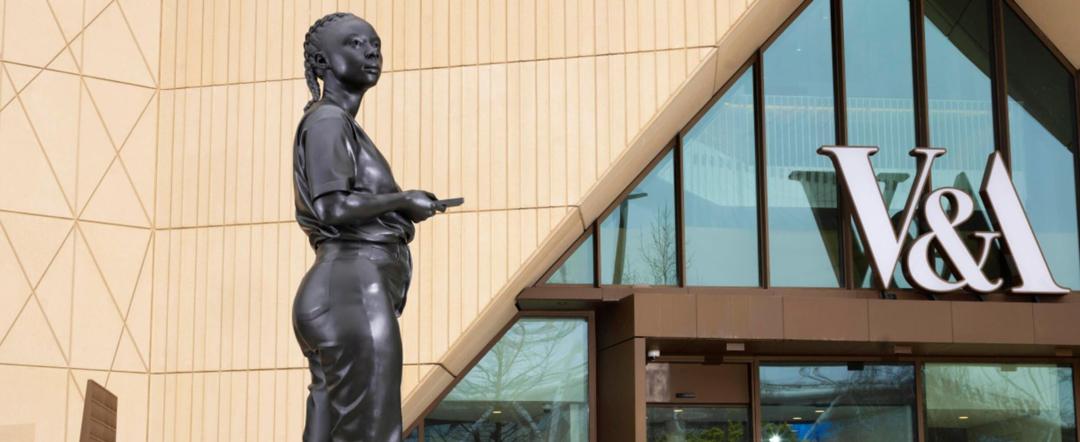 A bronze statue outside the V&A East Museum on East Bank, Queen Elizabeth Olympic Park.